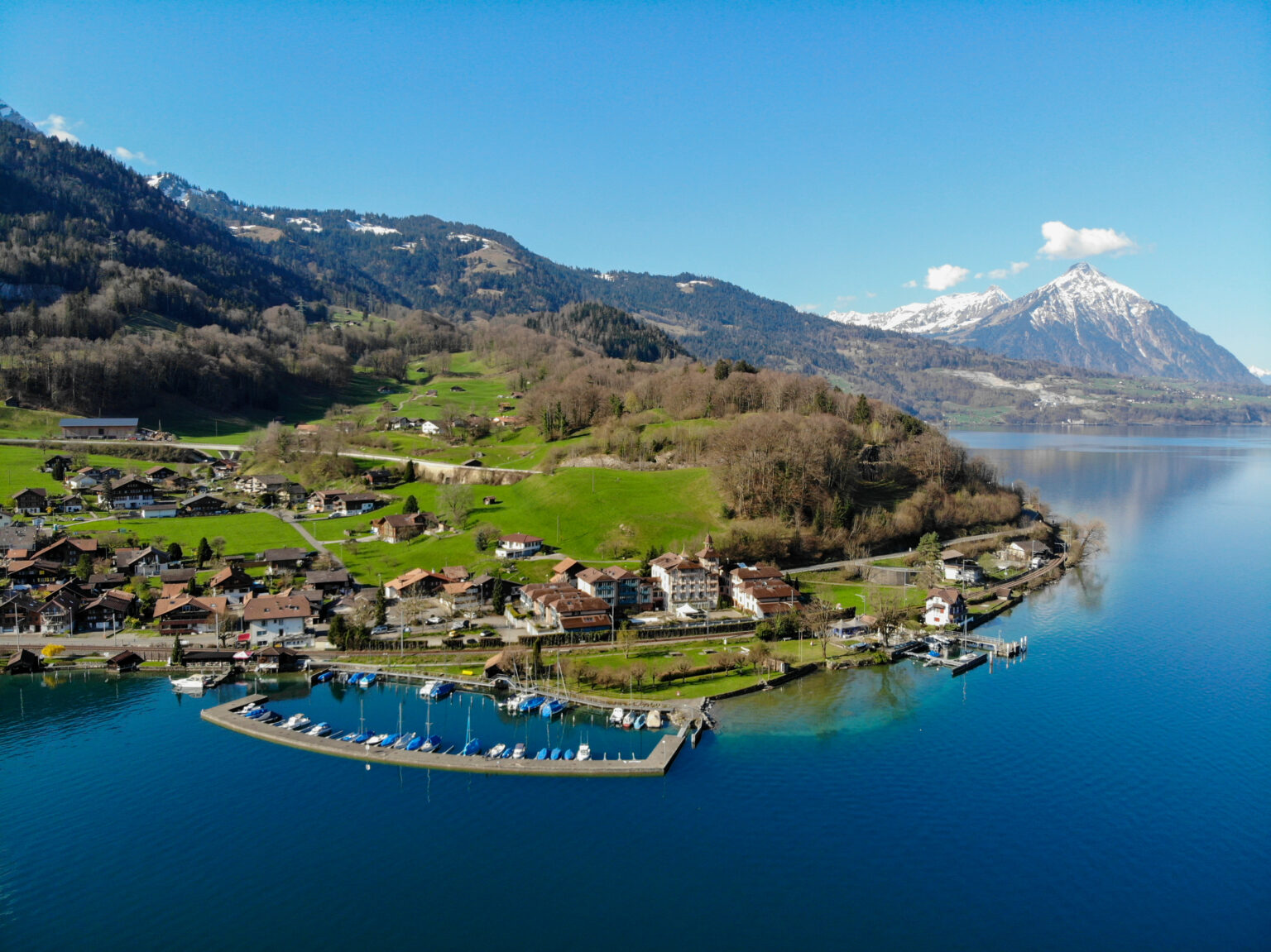 Aerial view of Därligen village and Hotel Du Lac beside Lake Thun